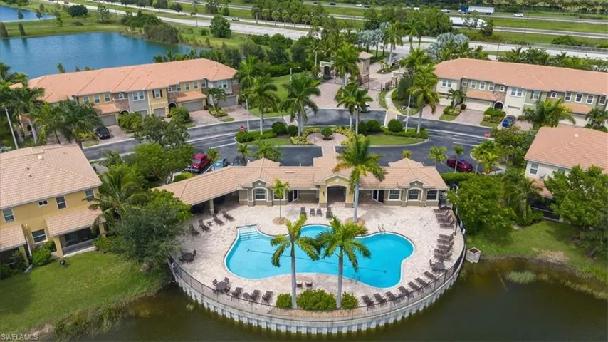 Aerial view of a nearby body of water and a pool area