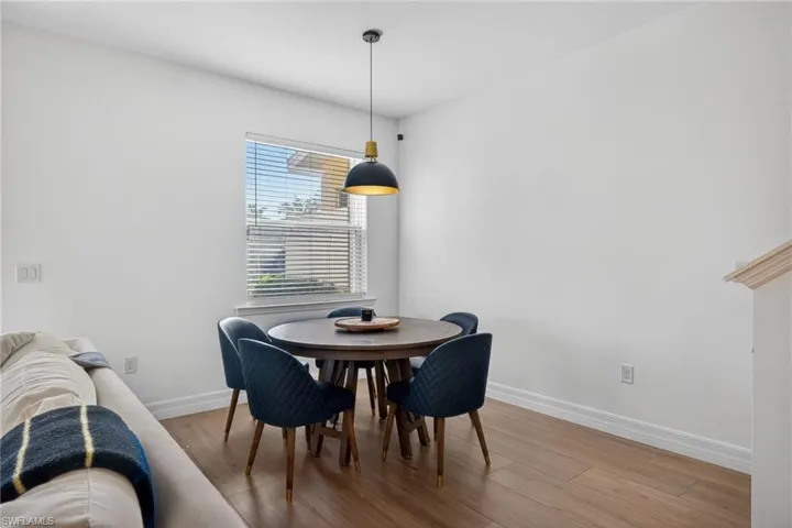 Dining area with light wood finished floors and baseboards
