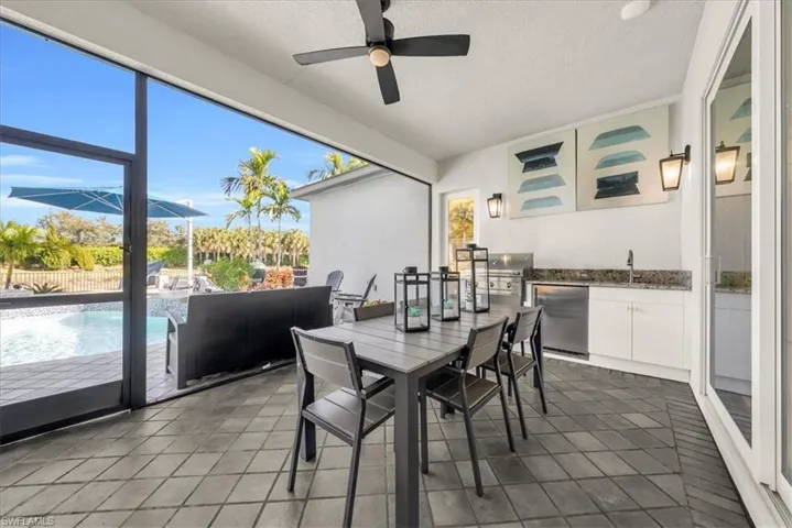 Sunroom featuring a sink