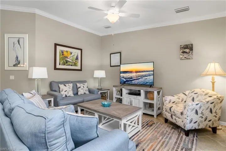 Great room is coastal and comfortable... Perfect for entertaining guests.