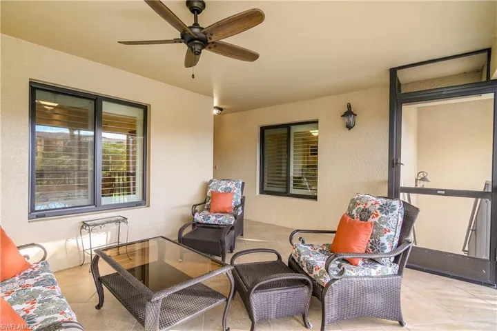This unit has TWO screened lanais--one at the entry and one at the back of the unit. This one is perfect for entertaining guests or enjoying your morning coffee or evening drink.