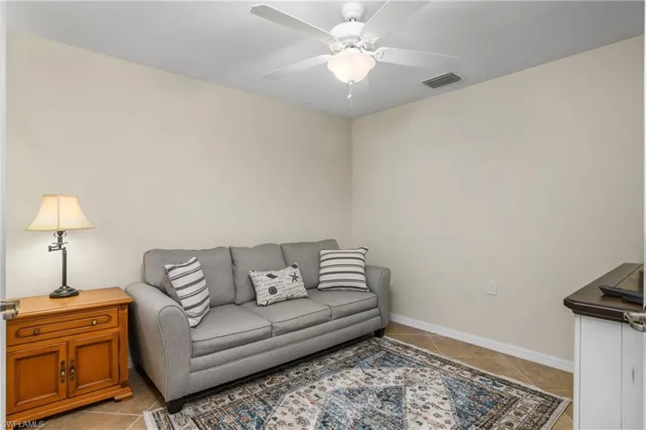 Den includes a sleeper sofa for additional guests.