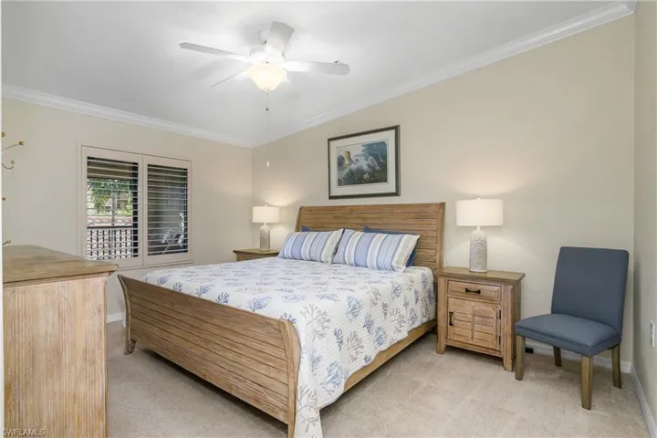 Owner's suite at front of home is spacious, featuring crown molding and plantation shutters.
