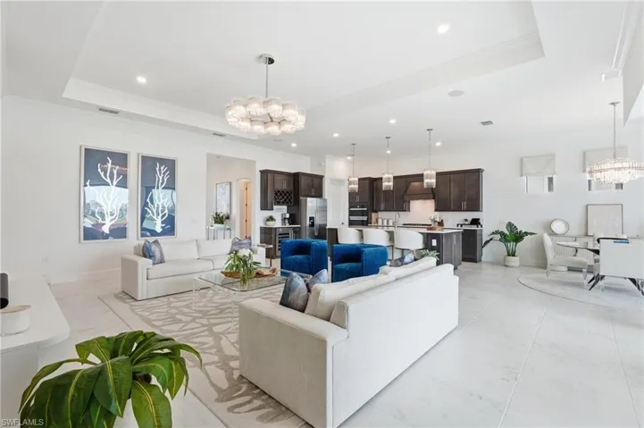 24x24 Porcelain Tile Flooring throughout the Living, Kitchen, Dining, Den and Foyer