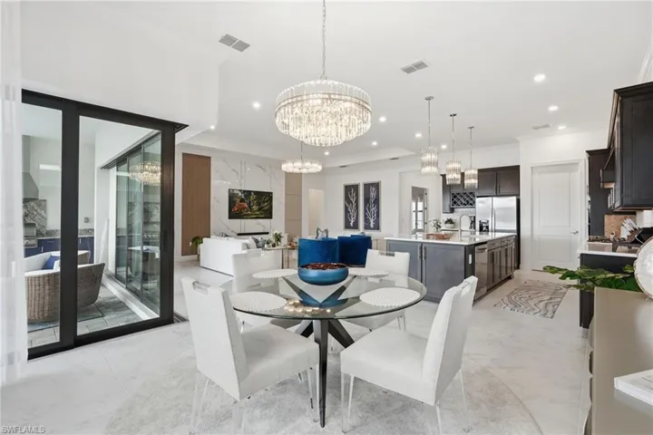 Elegant Dining Area with Pool and Outdoor Views