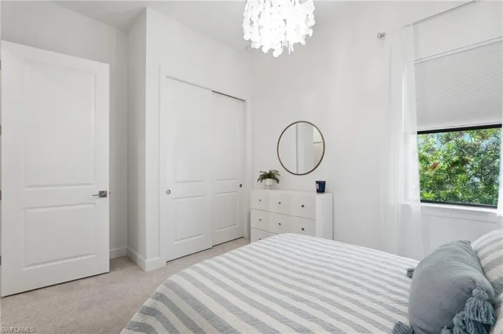 Bed 3 -Relaxing Guest Bedroom with Chandelier Lighting, Shades and Draperies