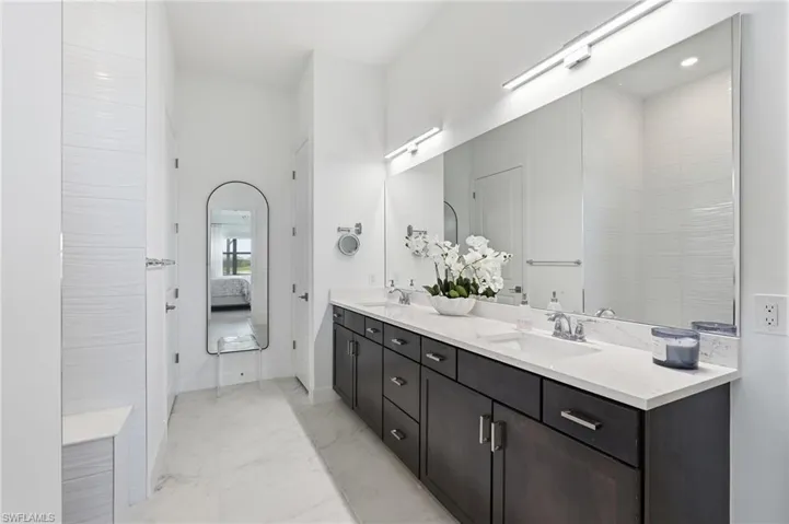 Dual Sink Vanities and Abundant Cabinet Storage with Modern Lighting