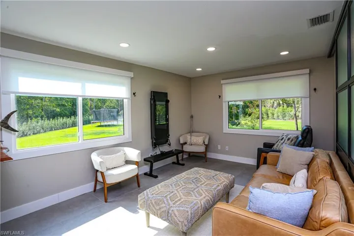Living room featuring recessed lighting and tile patterned floors