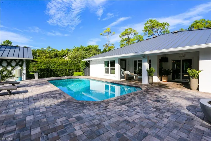 Outdoor pool featuring a patio