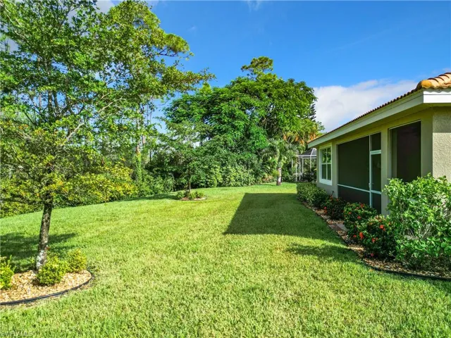 View of yard featuring a sunroom