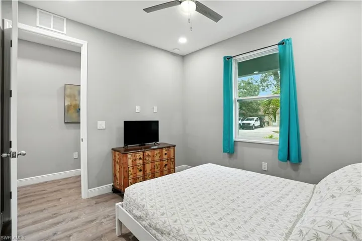 Bedroom with light wood finished floors, recessed lighting, and ceiling fan