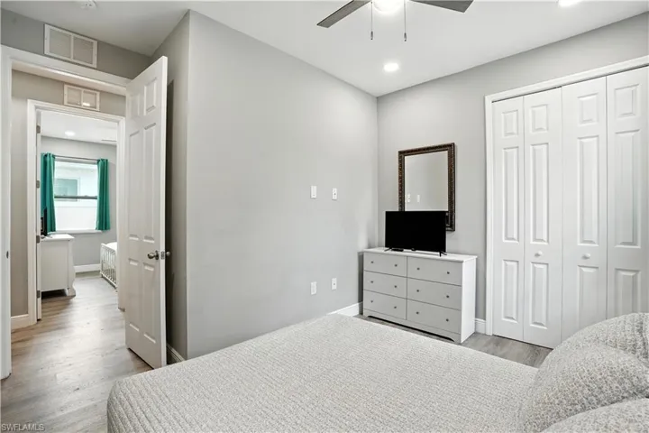 Bedroom featuring light wood-type flooring, recessed lighting, a closet, and ceiling fan