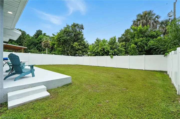 Fenced backyard with a patio area