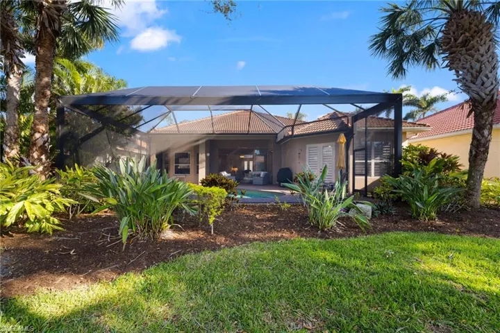 Rear view of house with a lanai
