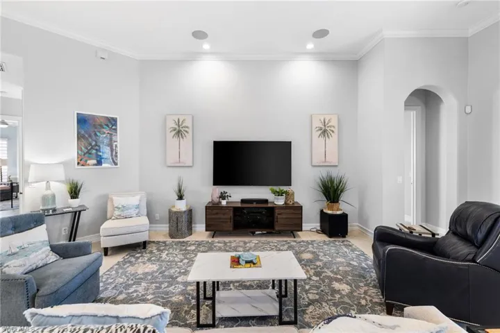 Living room featuring crown molding
