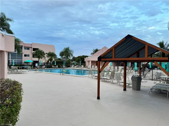 Community pool featuring a patio