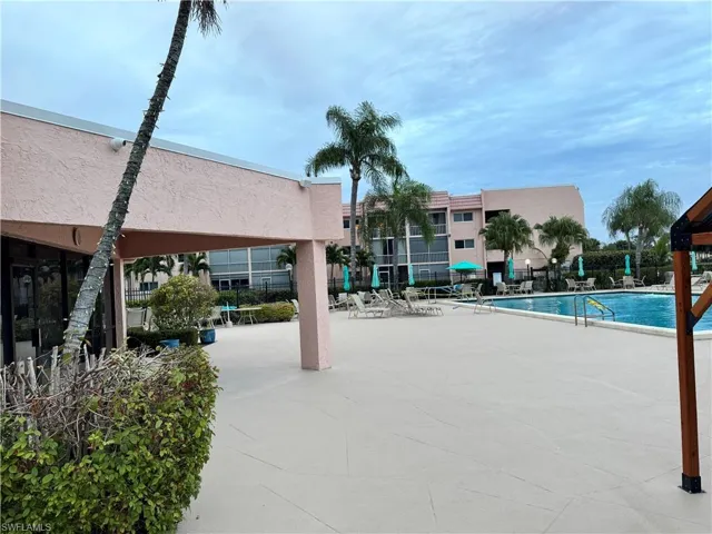 Community pool with a patio area