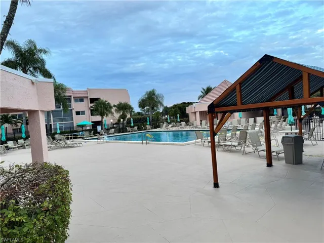 Community pool featuring a patio