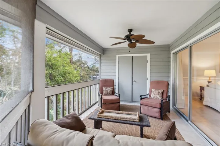 Sunroom featuring ceiling fan