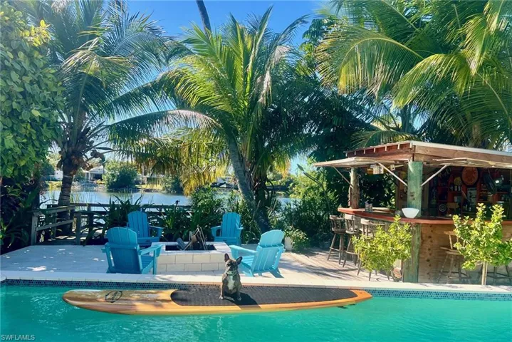 Swimming pool with a patio and a wooden deck