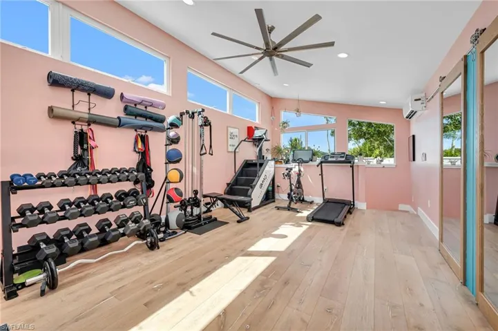 Workout room featuring recessed lighting and a ceiling fan