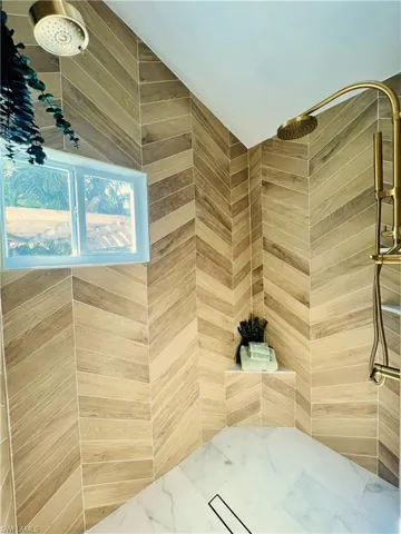 Full bath with tiled shower