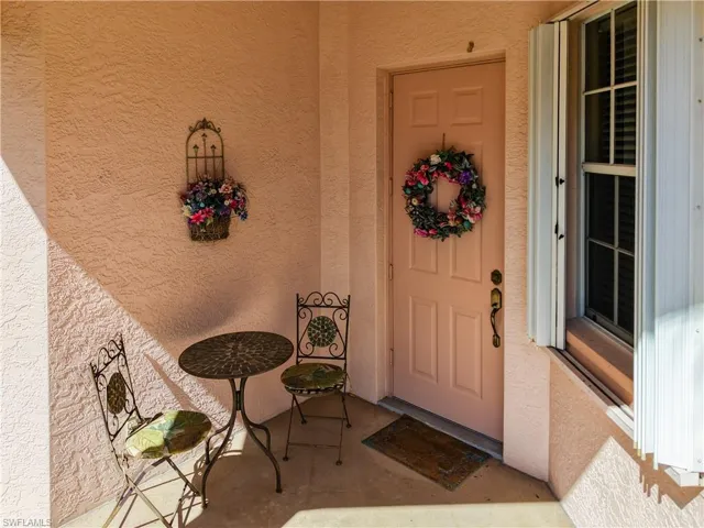 Entrance to property featuring stucco siding
