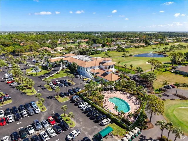 Aerial view featuring view of golf course and a water view