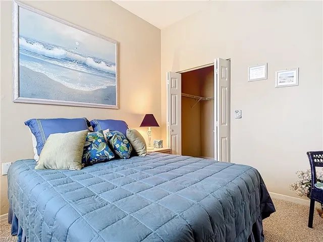 Carpeted bedroom with baseboards
