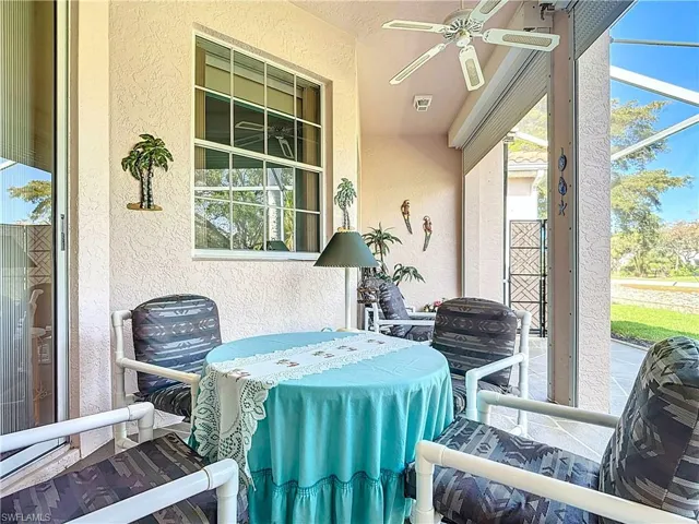 View of patio / terrace with glass enclosure and ceiling fan