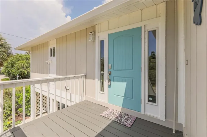Doorway to property featuring a deck