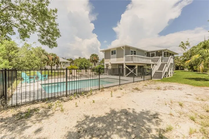 View of swimming pool featuring a wooden deck
