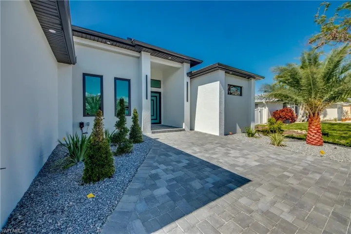 Back of house with a patio area