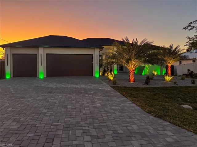 View of front facade featuring a garage