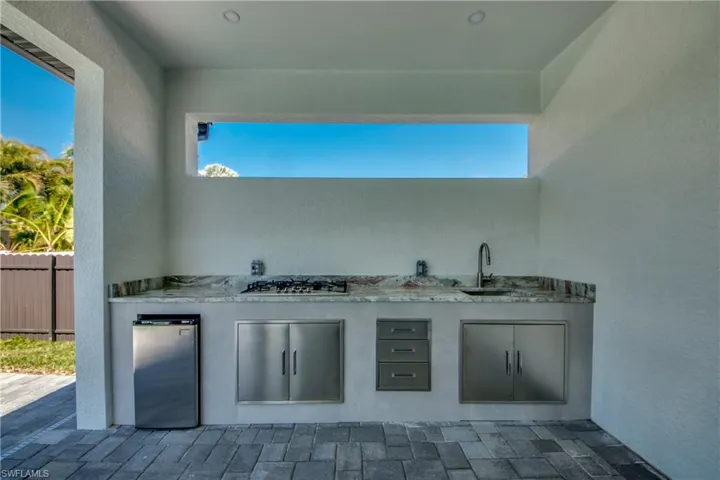 View of patio / terrace featuring exterior kitchen and sink