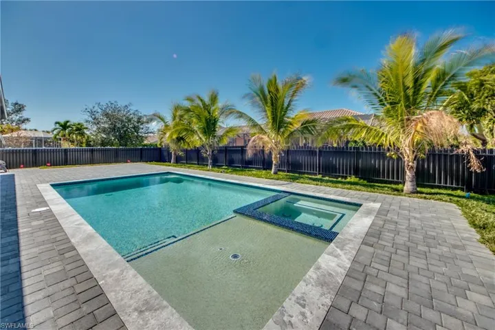 View of pool featuring a patio area and an in ground hot tub