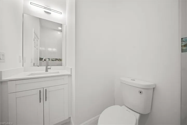 Bathroom featuring toilet and vanity