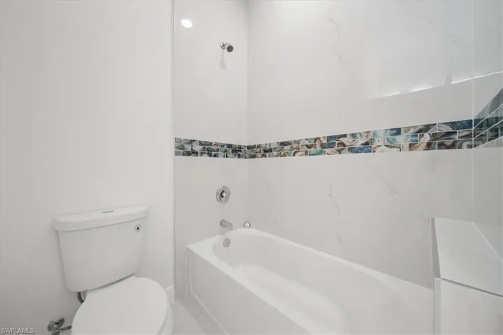 Full bathroom featuring toilet and bathtub / shower combination