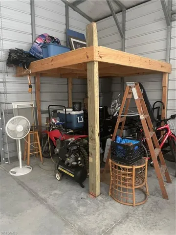 Garage featuring wooden walls