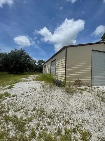 View of outdoor structure featuring a garage