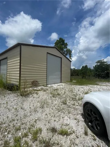 View of outbuilding with a garage