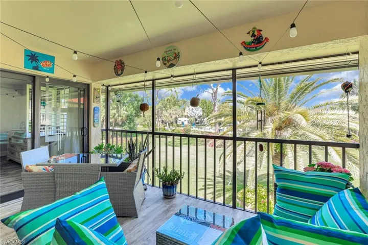 Sunroom featuring outdoor dining area