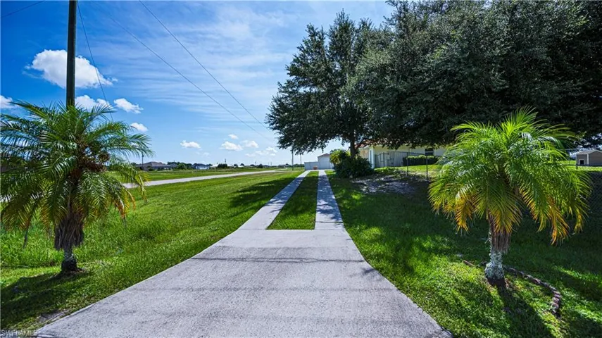 Surrounding community featuring a lawn