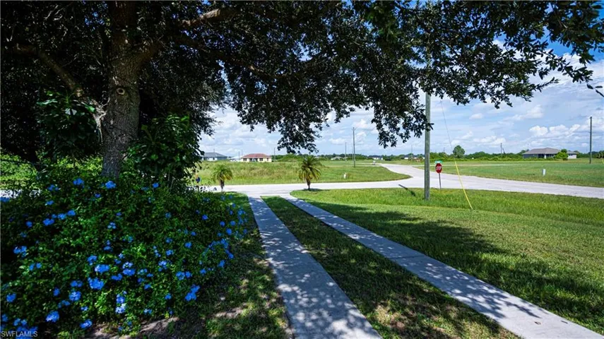 View of home's community featuring a lawn
