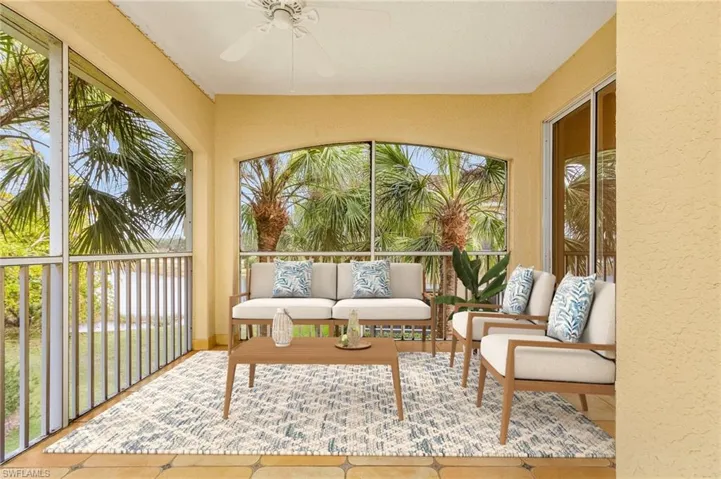 Sunroom with ceiling fan and a wealth of natural light