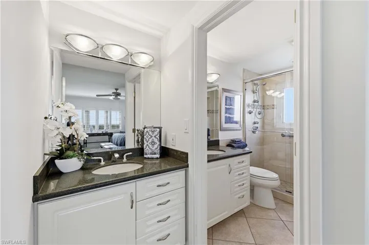 Primary bath with separate vanity area and bathroom