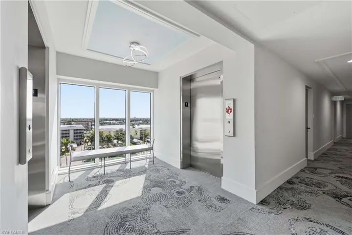 8th floor elevator entrance has a city view over the Bay.