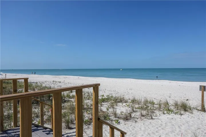 Wooded steps from pool to beach!