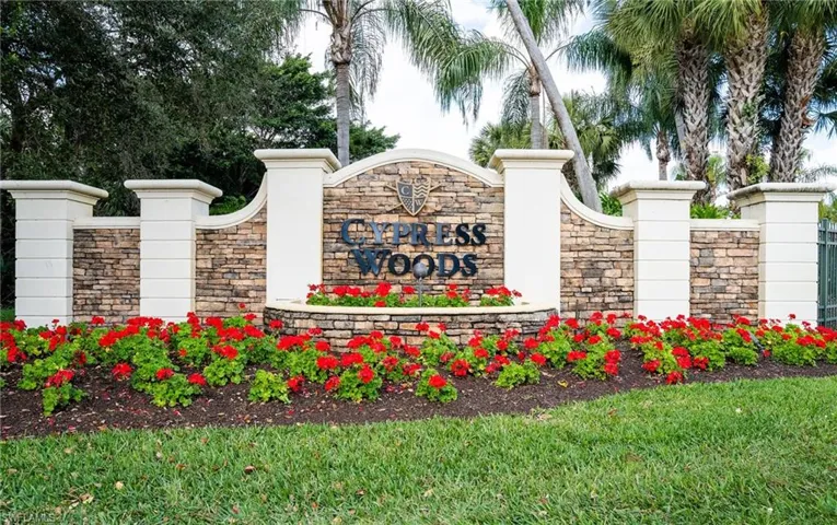 Community / neighborhood sign with a yard