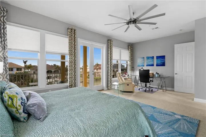 Bedroom featuring carpet, access to exterior, ceiling fan, and french doors